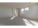 Bright bedroom featuring neutral walls and carpeted floors at 3224 W Garnet St, San Tan Valley, AZ 85144