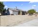 Single story home with two-car garage and neatly landscaped yard at 20820 N 16Th Ave, Phoenix, AZ 85027