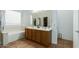 Bathroom with double vanity, bathtub, and shower at 13585 W Ironwood St, Surprise, AZ 85374