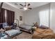 Small bedroom with twin beds, ceiling fan, and window coverings at 13585 W Ironwood St, Surprise, AZ 85374