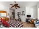 Bedroom with ceiling fan, dresser, and home exercise equipment at 13585 W Ironwood St, Surprise, AZ 85374