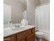 Clean bathroom with single sink vanity and shower/tub combo at 13585 W Ironwood St, Surprise, AZ 85374