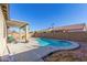 Inviting kidney shaped pool with a covered patio area at 13585 W Ironwood St, Surprise, AZ 85374