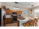 Kitchen with island, stainless steel appliances, and wood cabinets at 13585 W Ironwood St, Surprise, AZ 85374