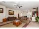 Spacious living room with ample seating and large windows for natural light at 13585 W Ironwood St, Surprise, AZ 85374
