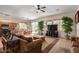 Comfortable living room featuring a large sofa and adjacent dining area at 13585 W Ironwood St, Surprise, AZ 85374