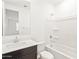 Clean bathroom, bathtub, and dark vanity at 17431 W Sanna St, Waddell, AZ 85355