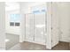 Bright bathroom featuring a shower with a built-in seat at 17431 W Sanna St, Waddell, AZ 85355