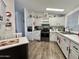 Modern kitchen with stainless steel appliances and white cabinets at 2400 E Baseline Ave # 301, Apache Junction, AZ 85119