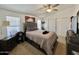 Comfortable bedroom with a queen-size bed and ceiling fan at 2400 E Baseline Ave # 301, Apache Junction, AZ 85119