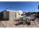 Backyard patio with table and chairs, and storage shed at 2400 E Baseline Ave # 301, Apache Junction, AZ 85119