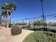 Well-maintained tennis court with mountain backdrop at 2400 E Baseline Ave # 301, Apache Junction, AZ 85119