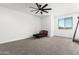 Spacious bedroom with a daybed and ceiling fan at 8823 W Wagon Wheel Dr, Glendale, AZ 85305