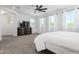 Bright bedroom featuring a large TV and ample space at 8823 W Wagon Wheel Dr, Glendale, AZ 85305