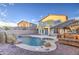 Resort style backyard with a large pool and tiki hut at 13729 W Country Gables Dr, Surprise, AZ 85379