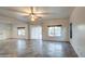 Spacious living room with tile floors, sliding glass doors, and a view of the pool at 13729 W Country Gables Dr, Surprise, AZ 85379