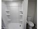 Clean bathroom with a shower/tub combo and white toilet at 9017 E Butternut Ave, Mesa, AZ 85208