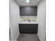 Small kitchenette with gray cabinets and white countertop at 9017 E Butternut Ave, Mesa, AZ 85208