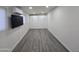 Spacious bonus room with gray flooring and white cabinets at 9017 E Butternut Ave, Mesa, AZ 85208