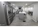 Modern kitchen with gray cabinets, stainless steel appliances and an island at 9017 E Butternut Ave, Mesa, AZ 85208