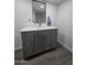 Gray vanity with quartz countertop in modern bathroom at 9017 E Butternut Ave, Mesa, AZ 85208