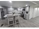 Modern kitchen featuring gray cabinets, island, and stainless steel appliances at 9017 E Butternut Ave, Mesa, AZ 85208