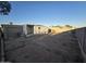 Exterior view of a manufactured home with a large backyard and a detached garage at 9017 E Butternut Ave, Mesa, AZ 85208