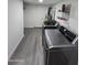 Bright laundry room with stacked LG washer and dryer at 9017 E Butternut Ave, Mesa, AZ 85208