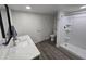 Modern bathroom with single vanity, toilet and shower at 9017 E Butternut Ave, Mesa, AZ 85208