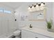 Clean bathroom with white vanity, a large mirror, and a shower/tub combo at 9610 W Carol Ave, Peoria, AZ 85345