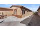 Side view of the house with gravel landscaping at 9610 W Carol Ave, Peoria, AZ 85345