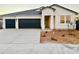 Newly constructed single-story home with a two-car garage and desert landscaping at 12367 E Bahia Ct, Florence, AZ 85132