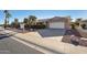 Brick ranch home with attached garage and desert landscaping at 12423 W Rock Springs Dr, Sun City West, AZ 85375