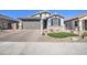 Stunning curb appeal with a two-car garage and landscaped yard at 34980 N Sacramento Wash Rd, San Tan Valley, AZ 85144