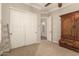 Well-lit bedroom with a large closet and wood accent pieces at 2299 E Saddlebrook Rd, Gilbert, AZ 85298