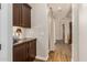 Hallway with dark wood cabinets and built-in storage at 2299 E Saddlebrook Rd, Gilbert, AZ 85298