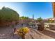 Landscaped backyard with patio furniture and grill at 2299 E Saddlebrook Rd, Gilbert, AZ 85298