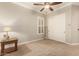 Bright bedroom featuring plantation shutters and a ceiling fan at 2299 E Saddlebrook Rd, Gilbert, AZ 85298
