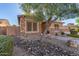 Craftsman style home with stone accents and desert landscaping at 2299 E Saddlebrook Rd, Gilbert, AZ 85298