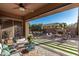 Covered patio offers seating area and views of backyard at 2299 E Saddlebrook Rd, Gilbert, AZ 85298
