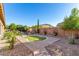 Landscaped backyard featuring a putting green at 2299 E Saddlebrook Rd, Gilbert, AZ 85298