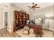 Bright home office with built-in shelving and a spacious desk area at 2299 E Saddlebrook Rd, Gilbert, AZ 85298