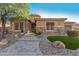 House exterior with stone accents and paver walkway at 2299 E Saddlebrook Rd, Gilbert, AZ 85298