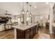 Modern kitchen with granite countertops and dark wood cabinets at 2299 E Saddlebrook Rd, Gilbert, AZ 85298