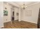 Spacious dining area with wood flooring and a chandelier at 2299 E Saddlebrook Rd, Gilbert, AZ 85298