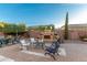 Outdoor patio with seating area and fireplace at 2299 E Saddlebrook Rd, Gilbert, AZ 85298