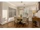 Bright dining room features a round table with seating for four and wood flooring at 2299 E Saddlebrook Rd, Gilbert, AZ 85298