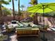 Serene backyard with pond, waterfall, and comfortable seating at 14679 N Love Ct, Fountain Hills, AZ 85268