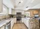 Updated kitchen with granite countertops, stainless steel appliances, and an island at 14679 N Love Ct, Fountain Hills, AZ 85268