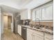 Modern kitchen features granite countertops, stainless steel appliances, and white cabinetry at 14679 N Love Ct, Fountain Hills, AZ 85268